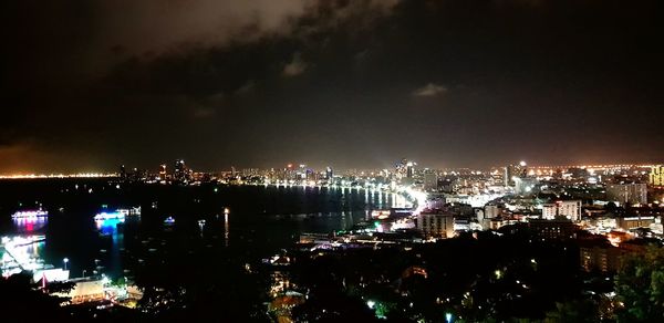 High angle view of illuminated buildings in city at night