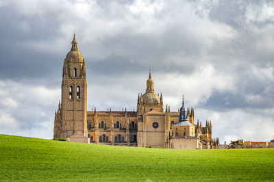 Low angle view of historic building against cloudy sky