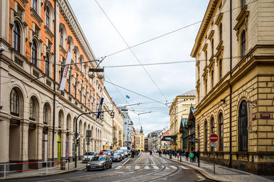 Cables over street amidst residential buildings