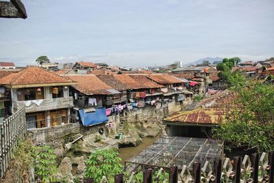 Houses in city against sky