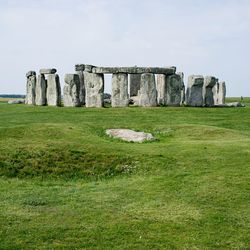 Built structure on field against sky