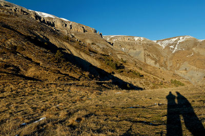 Shadow of man on rock