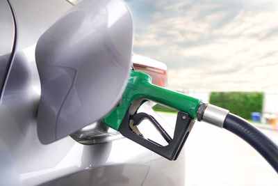 Close-up of car refueling at gas station