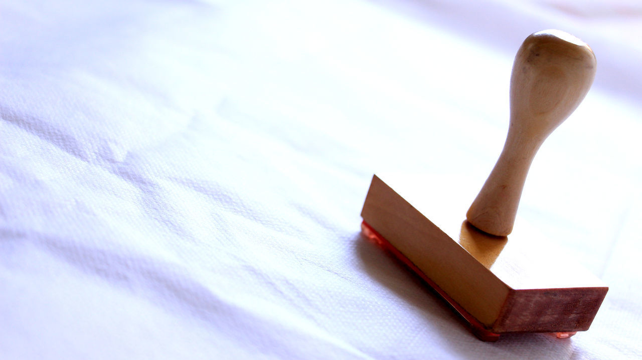 HIGH ANGLE VIEW OF PAPERS ON TABLE