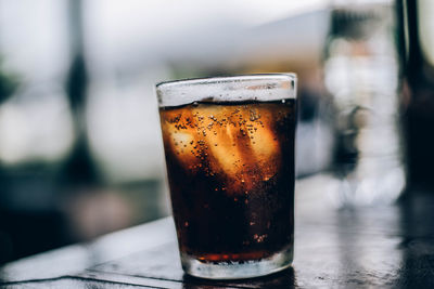 Close-up of beer glass on table