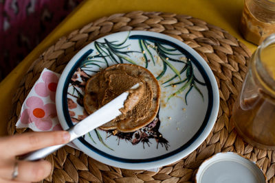 Directly above shot of person holding bread