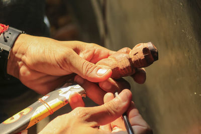 Close-up of man holding ice cream