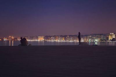 Man in city at night