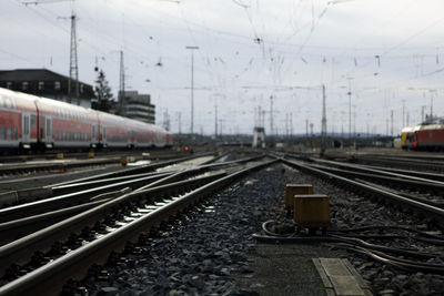 Train at railroad station platform against sky