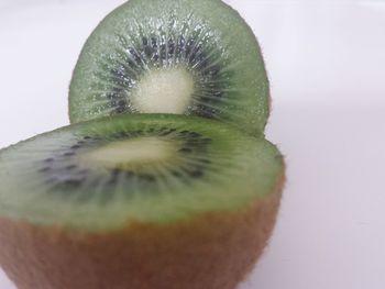 Close-up of lemon slice over white background