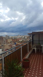 View of cityscape against cloudy sky