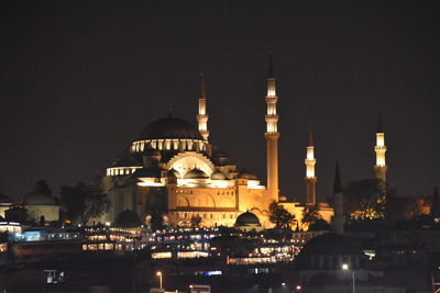 Illuminated buildings in city at night