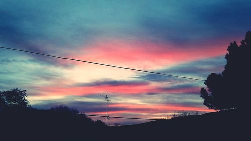 Low angle view of cloudy sky at sunset