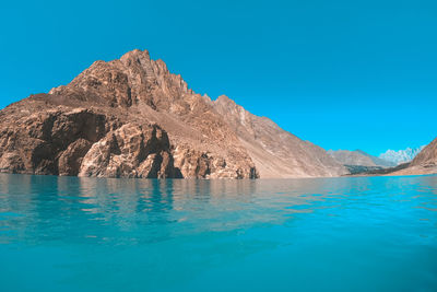 Scenic view of sea against clear blue sky