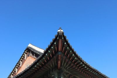 Low angle view of building against blue sky