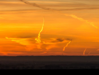 Scenic view of landscape against sky during sunset