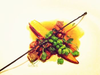 Close-up of fruit over white background