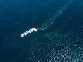 High angle view of sea against blue sky