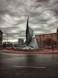 Scenic view of city against dramatic sky
