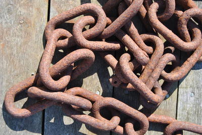 High angle view of rusty chain on table