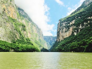 Scenic view of river and mountains