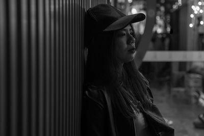 Portrait of young woman looking away outdoors