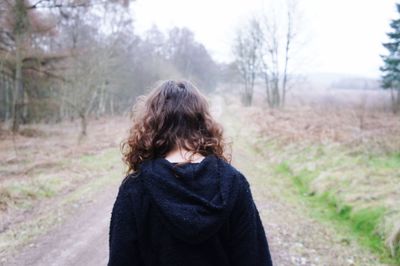 Rear view of woman in winter