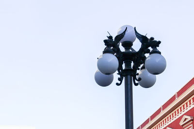 Low angle view of street light against clear sky