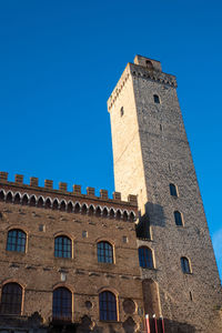 Main tower of city of san gimignano in early morning, tuscany