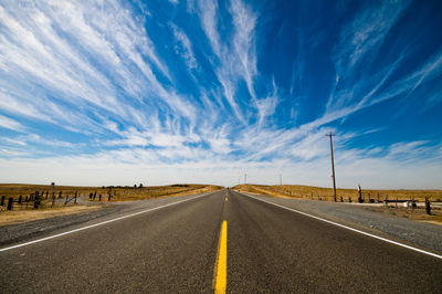 Empty road against sky