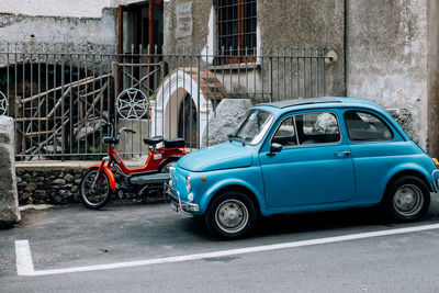 Car parked on street against building