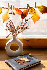 Autumn aesthetic still life on windowsill. fall home decorating.