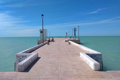 Pier over sea against sky