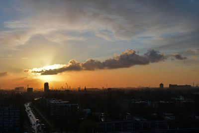 High angle view of buildings against sky during sunset