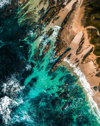 High angle view of rock formation in sea