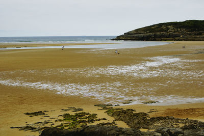 Scenic view of beach against clear sky