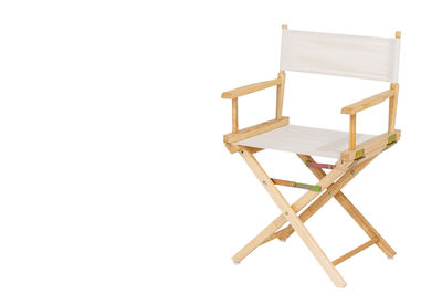 Close-up of empty chair against white background