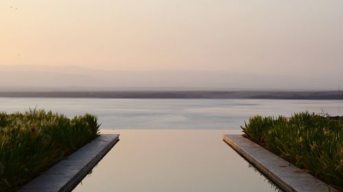 Scenic view of sea against sky during sunset