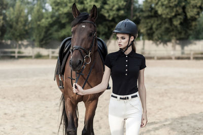 Full length of man riding horse