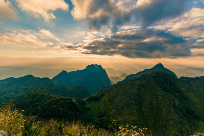 Beautiful scenic mountain background with blue sky, cloud and blast horizon sun