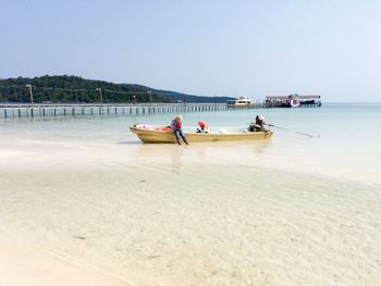 Side view of a boat at beach