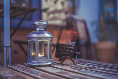 Close-up of illuminated light bulb on table