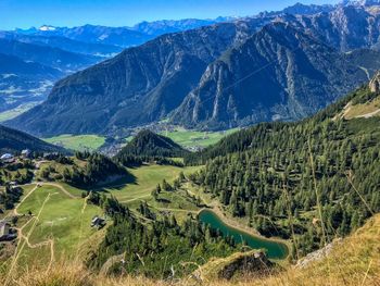 Scenic view of landscape and mountains against sky