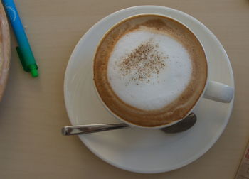 High angle view of coffee cup on table