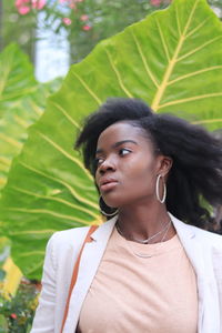 Portrait of young woman looking away