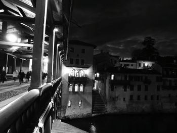 Illuminated buildings against sky at night