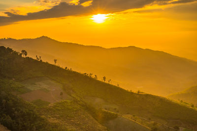 Scenic view of mountains against sky during sunset