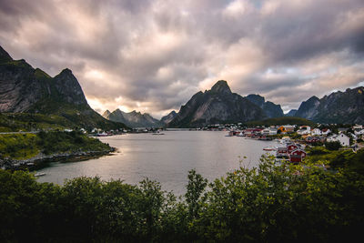 Scenic view of sea and mountains against sky