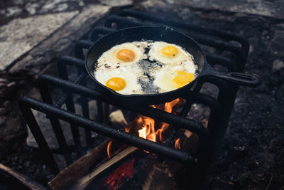 High angle view of food on campfire