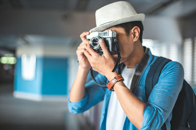 Midsection of woman photographing